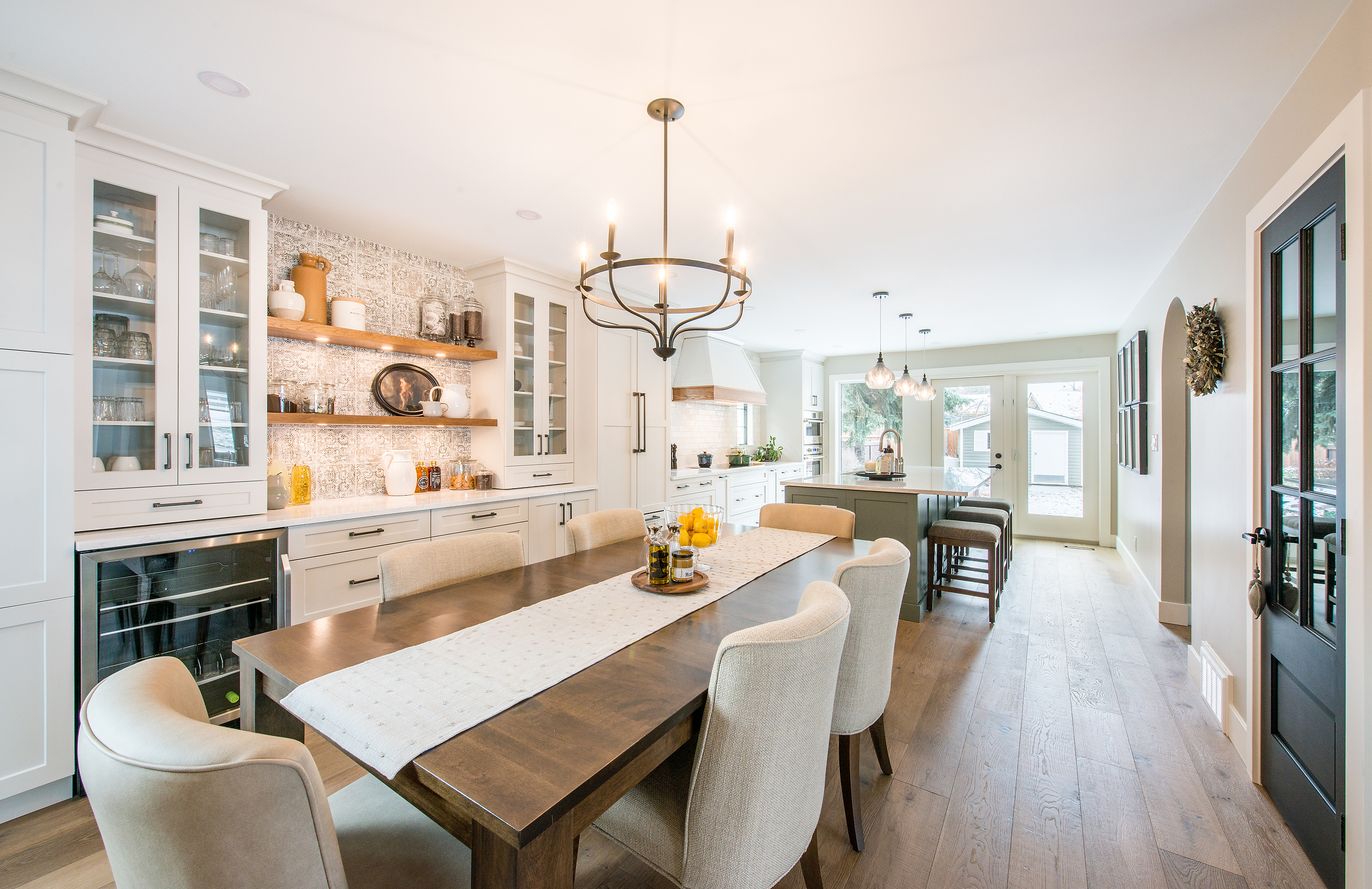 Kitchen renovation with large sage island and beautiful custom table and chairs