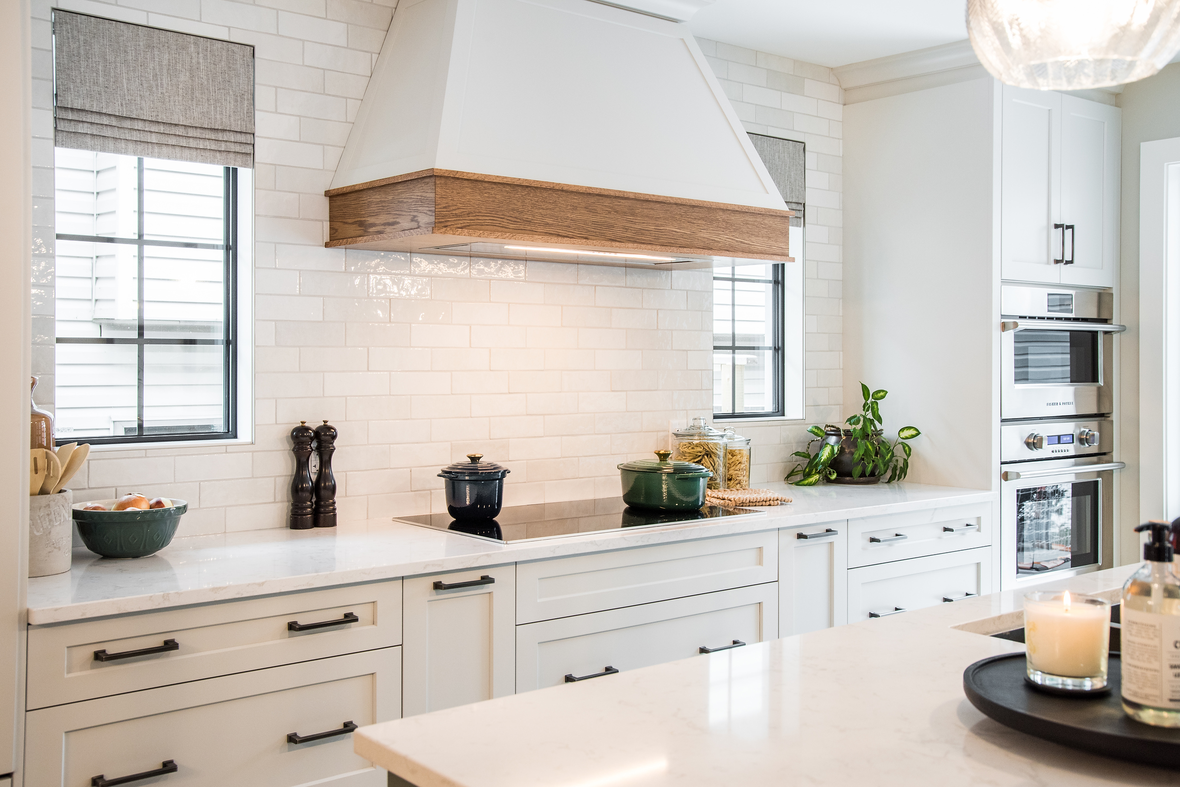 White kitchen with classic subway tile, white cabinetry and quartz countertops. Renovation of an Edmonton home